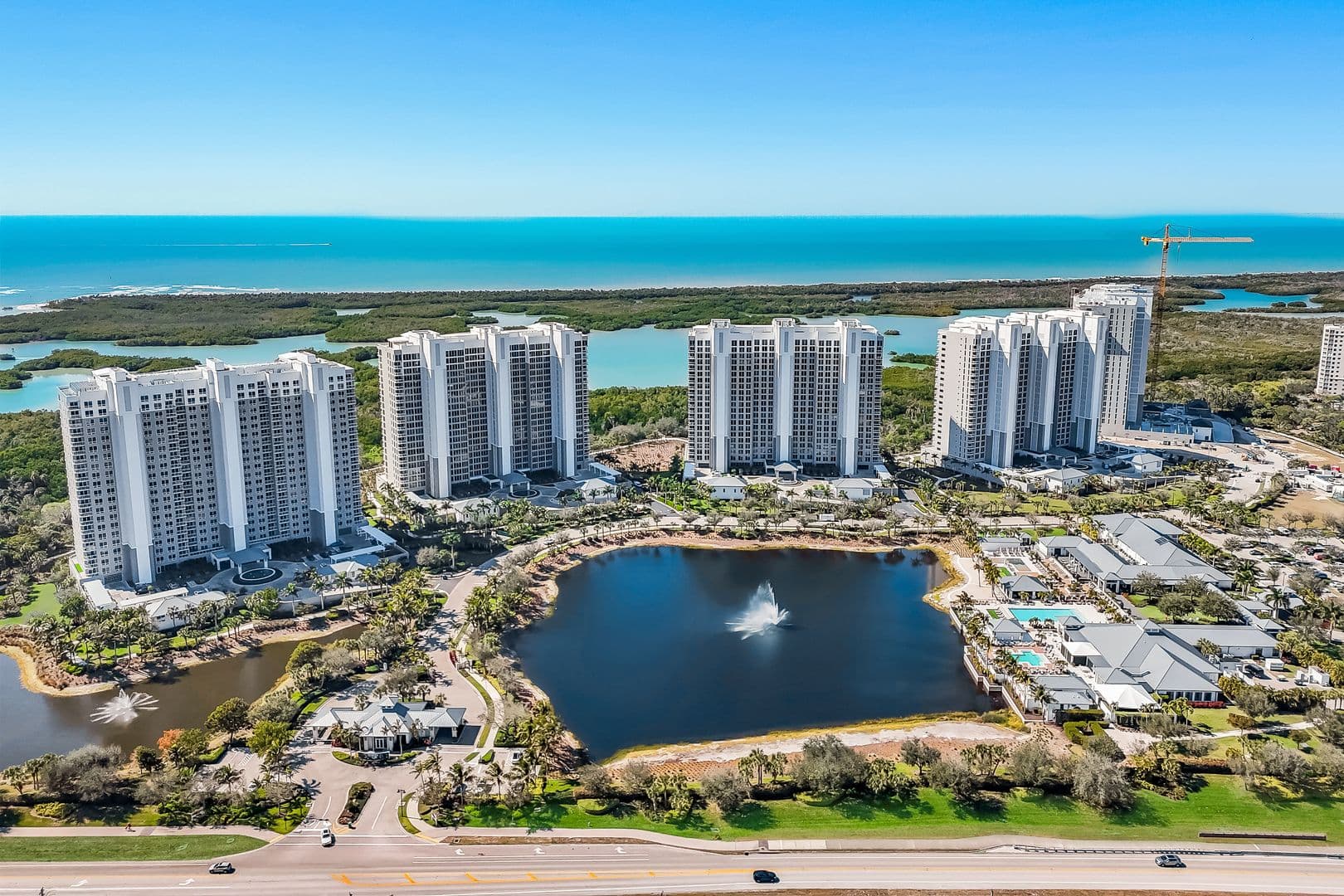 Aerial view of the five Kalea Bay condominium towers along the Gulf of Mexico in North Naples, Florida